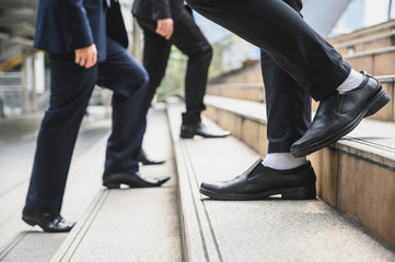 Business people walking on the stairs With a backdrop to the metropolis Finance, application