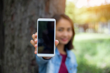 Closeup of hand using smartphone with effects