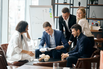 cheerful leader and his team analizing the document, woman in striped stylish suit offering goods ,...