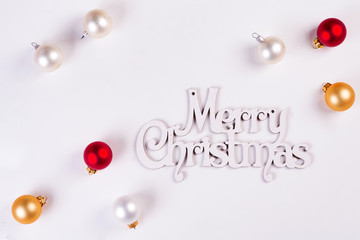 Christmas Holiday Balls and letter Merry Christmas isolated on a white background