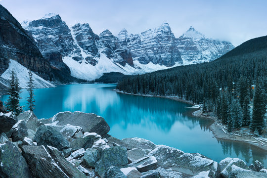 First snow Morning at Moraine Lake in Banff National Park Alberta Canada Snow-covered winter mountain lake in a winter atmosphere. Beautiful background photo