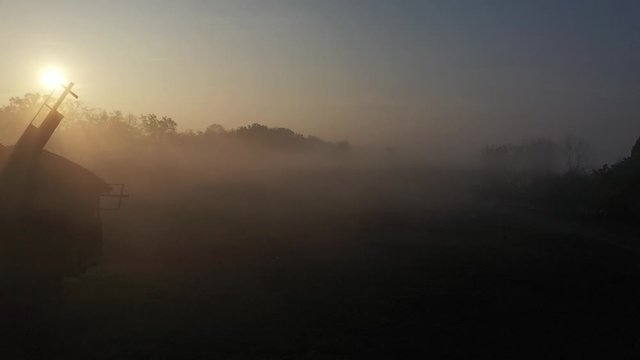 Autumn, countryside, sunrise and morning fog. Church. Mills.