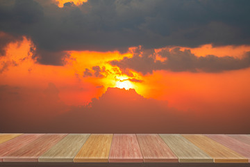Fototapeta na wymiar wooden table with view Sunset sky backdrop.you can used for display products. or add your own text on space.