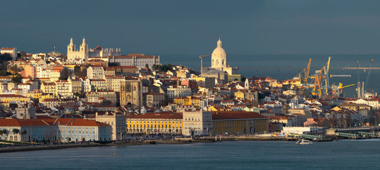 Aerial panorama of Lisbon old city center at sunset, view from Almada, Portugal