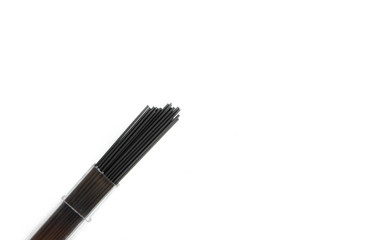 Graphite pencil rod close-up on a white background. Professional haircuts for drawing