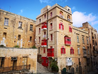 Fototapeta na wymiar characteristic balconies in the streets of Valletta