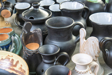 Obraz na płótnie Canvas The fair of folk craftsmen of pottery. Handmade clay pots