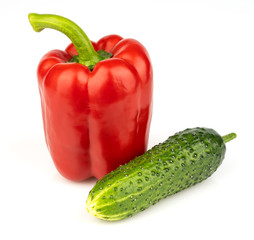 Cucumber with pepper on a white background. Vegetables on a white background. Fresh multicolored vegetables on white background