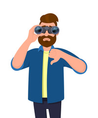 Unhappy young man looking in the distance through binoculars and gesturing, making thumbs down sign with hand finger. Person is seeing from binocular. Modern lifestyle, bad, negative, dislike concept.