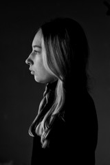 sad girl on a background of an old wall