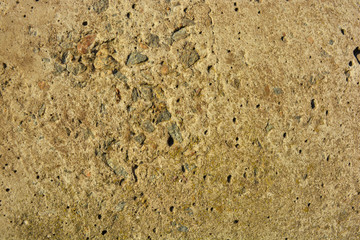 Old polished cement with flaws and bumps, reinforced concrete slab in the sunlight. Construction work, building facade background from natural Ukrainian cement.
