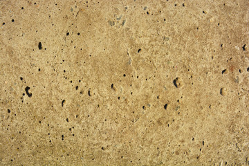 Old polished cement with flaws and bumps, reinforced concrete slab in the sunlight. Construction work, building facade background from natural Ukrainian cement.