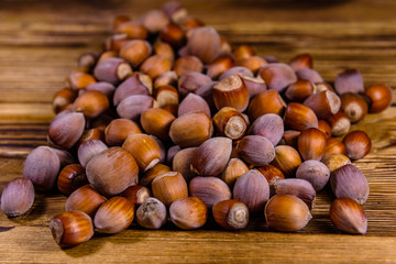 Pile of the hazelnuts on wooden table
