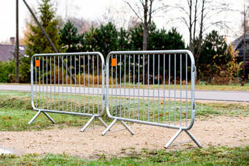 Barrier, metal fence for security for holding off people and transport