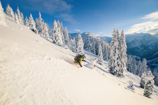 Man Skiing in deep powder snow in the Austrian Alps, Zauchensee, Salzburg, Austria