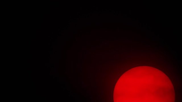 Red sun sphere in thick smog