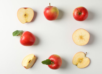 Flat lay with red apples on white background, space for text