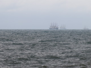 sailing ships on the horizon