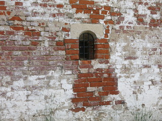 red battered brick wall 