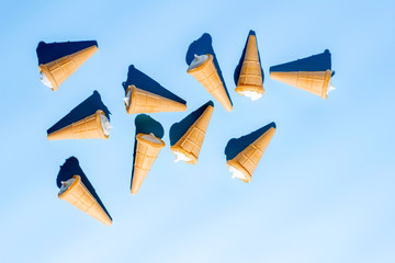 Ice cream cones on blue table. Summer background.