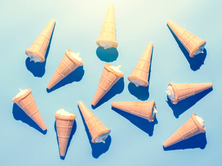 Ice cream cones on blue table. Summer background.