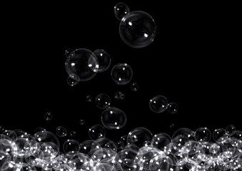Clear soap bubbles on black background