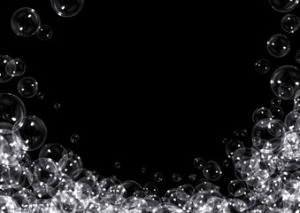 Clear soap bubbles on black background with copy space