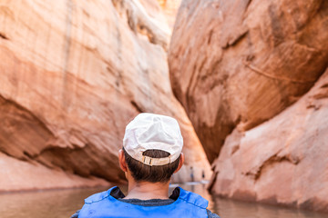Back of man in cap hat swimming kayaking in Lake Powell water narrow antelope canyon and life jacket vest © Kristina Blokhin