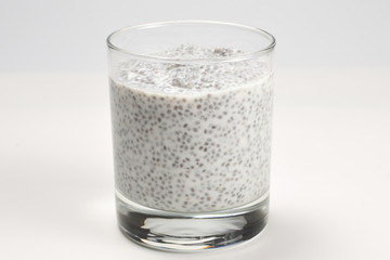 Chia pudding  in glass on a white background. Space for text or design.