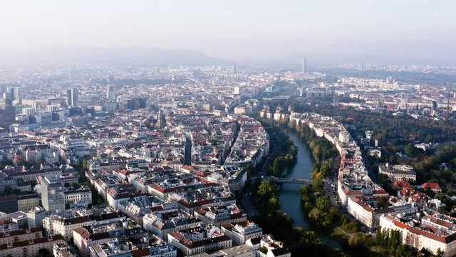 Vienna aerial view in Austria is one of the most famous capital cities of Europe. Flying by above Danube River, the historic city centre feat. old buildings around the downtown in HD and 4K