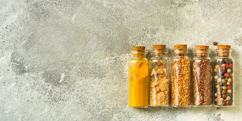 spices, many different types, textures (peas, red pepper, black pepper, turmeric, mountain salt, chia seeds, mustard and much more) menu concept. food background. copy space. Top view