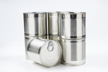 Group of silver canned food on white background.