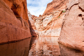 Lake Powell narrow antelope canyon with reflection on water surface and rock formations with nobody desert landscape view