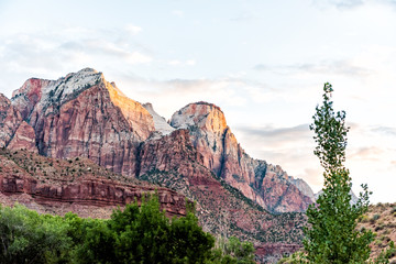 Zion National Park in Utah with landscape view of sunrise at red pink formation rock cliffs near...