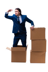 Young male employee with boxes isolated on white