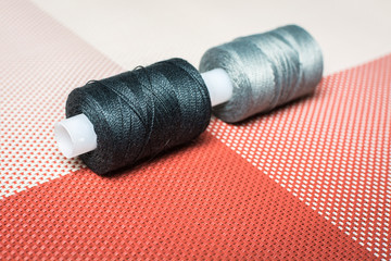 Sewing threads on bobbins for sewing.