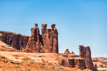 Closeup of the Three Gossips butte or mesa canyon with red rock during day in Moab, Utah near...
