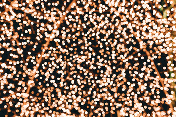 Gold abstract bokeh lights background. Defocused