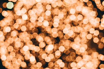 Gold abstract bokeh lights background. Defocused