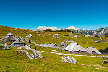 Fototapeta na wymiar Big Pasture Plateau or Velika Planina in Slovenia. traditional Wooden Shepherd Shelters in Mountains