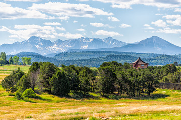 View of San Juan mountains from highway 145 in Colorado with beautiful valley and trees on summer...
