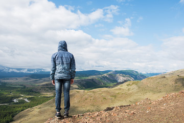 Fototapeta premium Man watching to glacier in Altai mountains. Resting in mountains or global warming concept