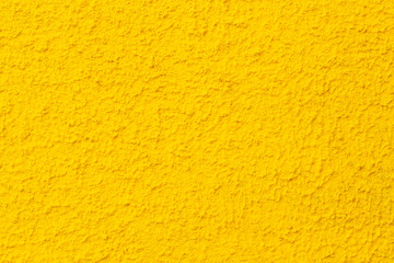 yellow wall texture background. Photo of yellow textured plaster wall.