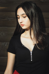 Portrait of a young beautiful teenager girl with long hair. Vertical photograph.