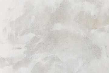 white washed painted concrete wall texture abstract background with brush strokes in gray and black...