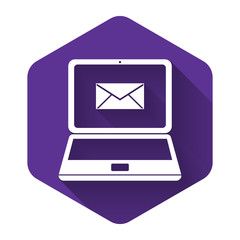 White Laptop with envelope and open email on screen icon isolated with long shadow. Email marketing, internet advertising concepts. Purple hexagon button. Vector Illustration