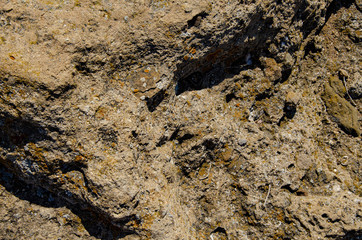 Background, natural stone, rock on the seashore.