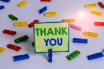 Conceptual hand writing showing Thank You. Concept meaning polite expression used when acknowledging gift service compliment Colored clothespin papers empty reminder white floor office