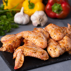 Raw marinated chicken wings ready to cook. Closeup