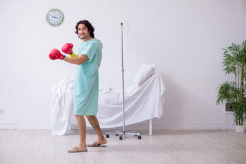 Young man staying in hospital in transfusion concept